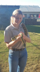 girl carrying a snake